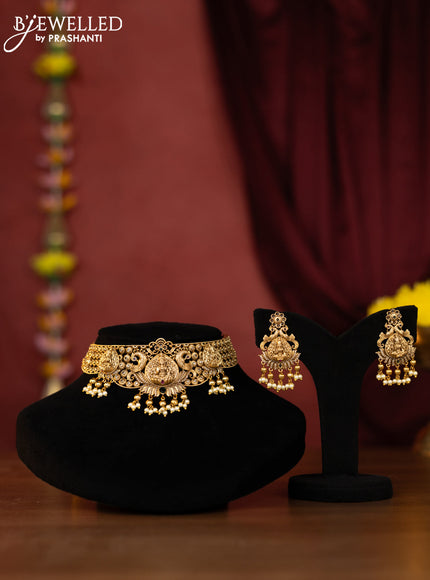Antique choker lakshmi design with kemp and green stones and pearl hanging
