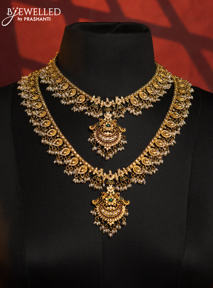 Antique guttapusalu combo set with double peacock design with kemp and white stones and rice pearl hanging