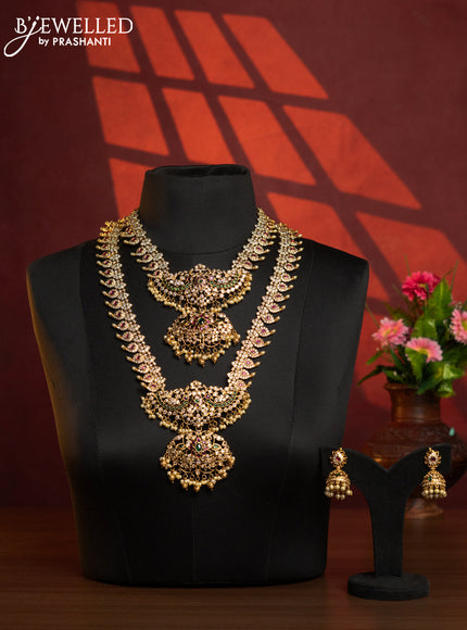 Antique combo set in maanga desogn with white and kemp stones and golden ball hanging