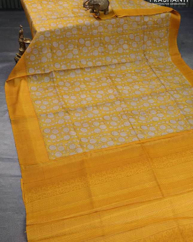 Pure tussar silk saree yellow and mustard yellow with allover floral prints and printed border