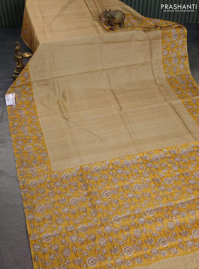 Pure tussar silk saree beige and yellow with allover zari checked pattern and kalamkari printed border