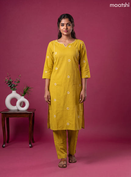 Mustard Yellow Cotton Printed & Simple Embroidery Work Neck Pattern Straight Suit