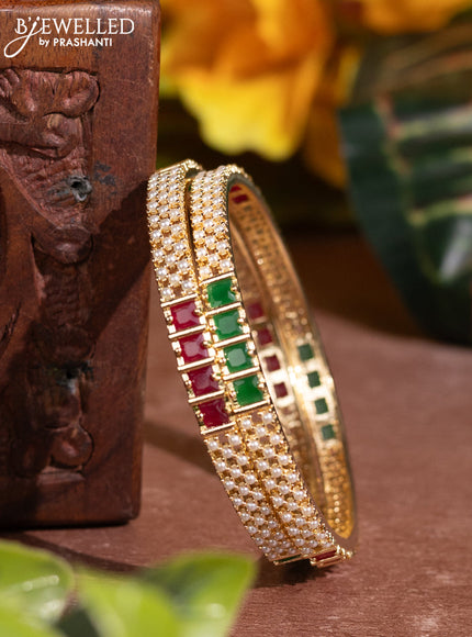 Pearl bangles with kemp stones and pearls in gold finish