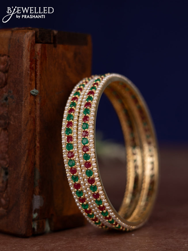 Pearl Bangles with kemp stones and pearls in gold finish