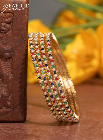 Pearl bangles with multicolour stones and pearls in gold finish