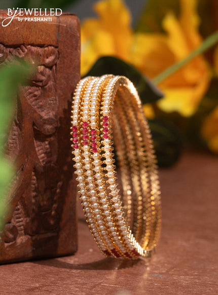 Pearl bangles with ruby stones and pearls in gold finish
