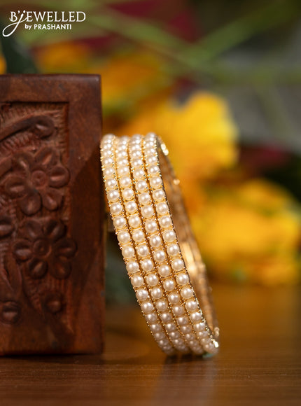Pearl Bangles with pearls in gold finish