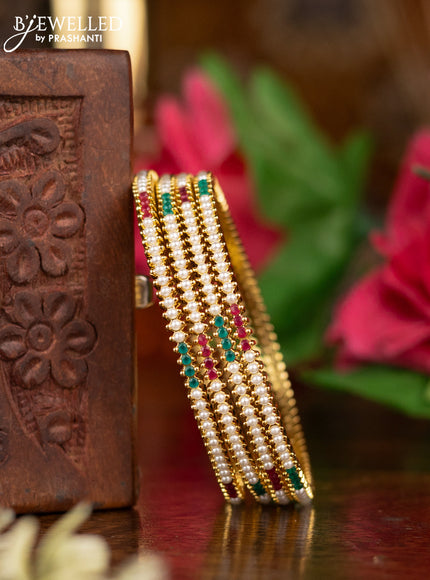 Pearl Bangles with kemp stones pearls in gold finish