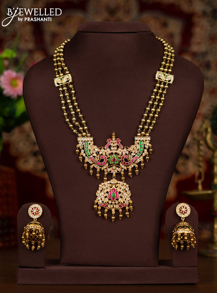 Antique haaram with double peacock pendant in jadau and white stones with golden beads hanging