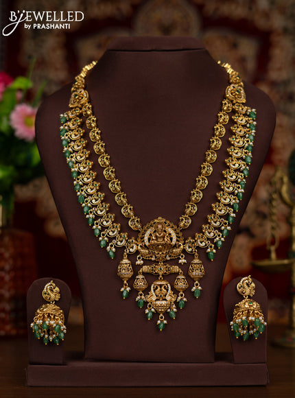 Antique haaram with double layer lakshmi pendant with kemp stones and green beads hanging