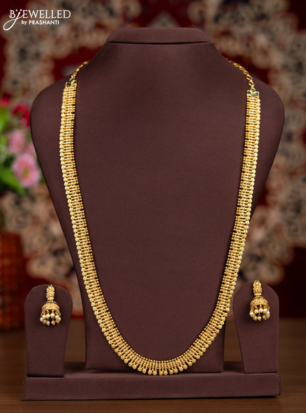 Antique haaram with simple design and emerald stones