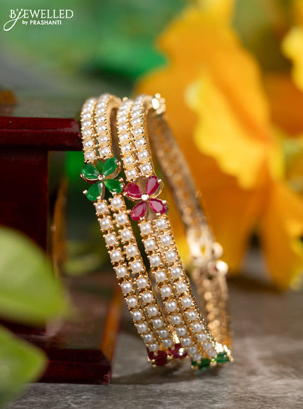 Pearl bangles floral design with kemp stones and pearls in gold finish