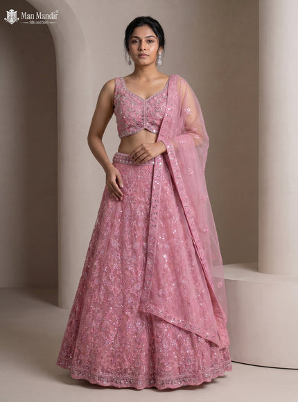 Peach Pink Netted Lehenga Set With Can Can Skirt & Mirror Embroidered Blouse