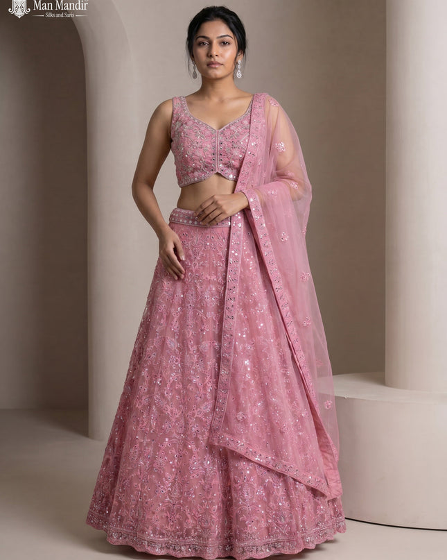 Peach Pink Netted Lehenga Set With Can Can Skirt & Mirror Embroidered Blouse