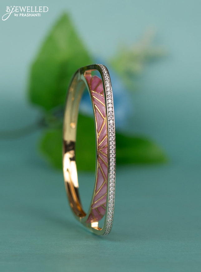 Zircon bracelet with light pink enamal and cz stones in gold finish