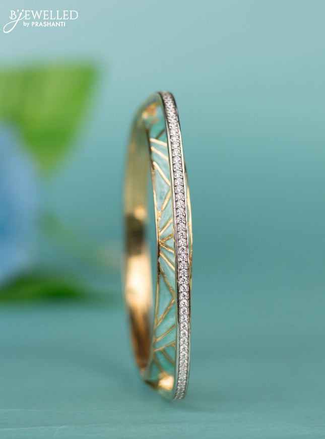 Zircon bracelet with ice blue enamal and cz stones in gold finish