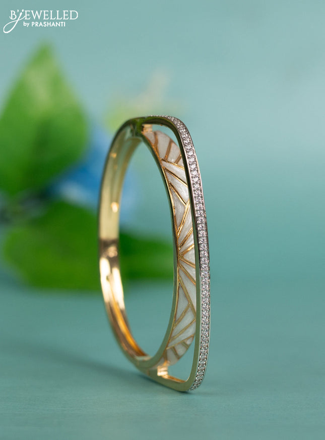 Zircon bracelet with white enamel and cz stones in gold finish