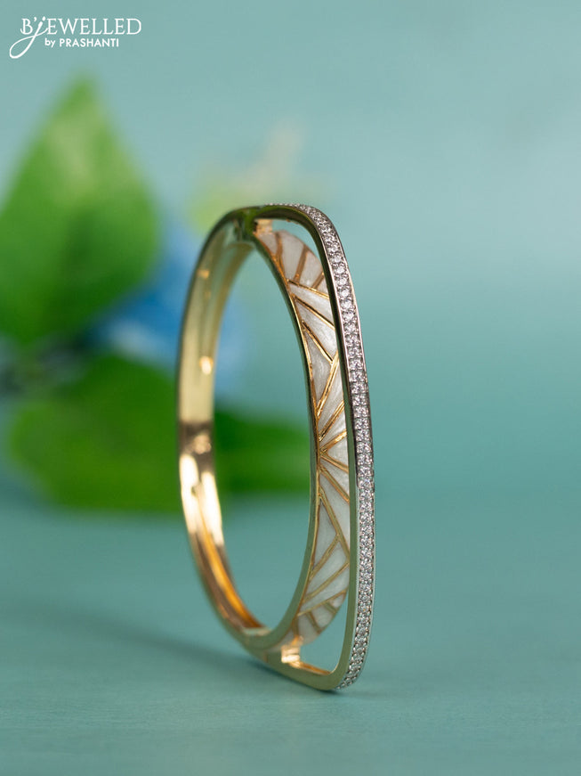 Zircon bracelet with white enamel and cz stones in gold finish