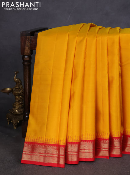 Pure kanchipuram silk saree mustard yellow and red with plain body and zari woven korvai border