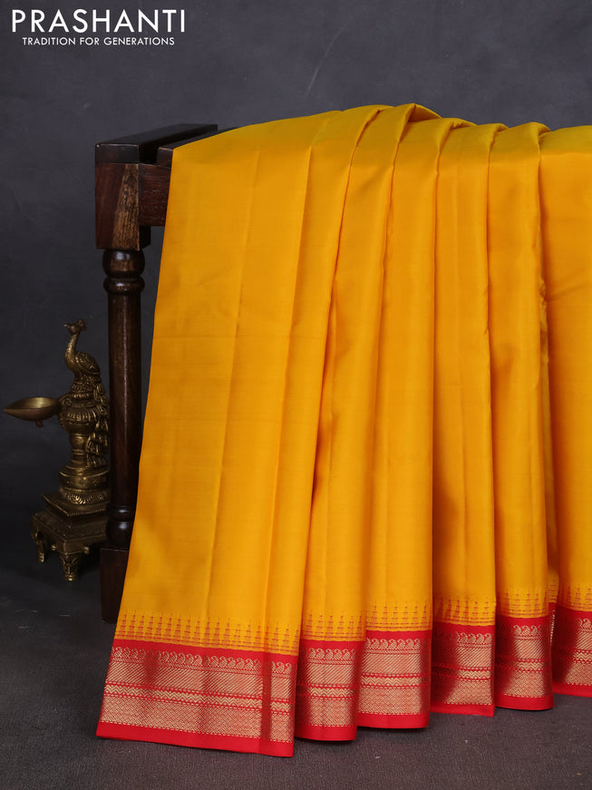 Pure kanchipuram silk saree mustard yellow and red with plain body and zari woven korvai border