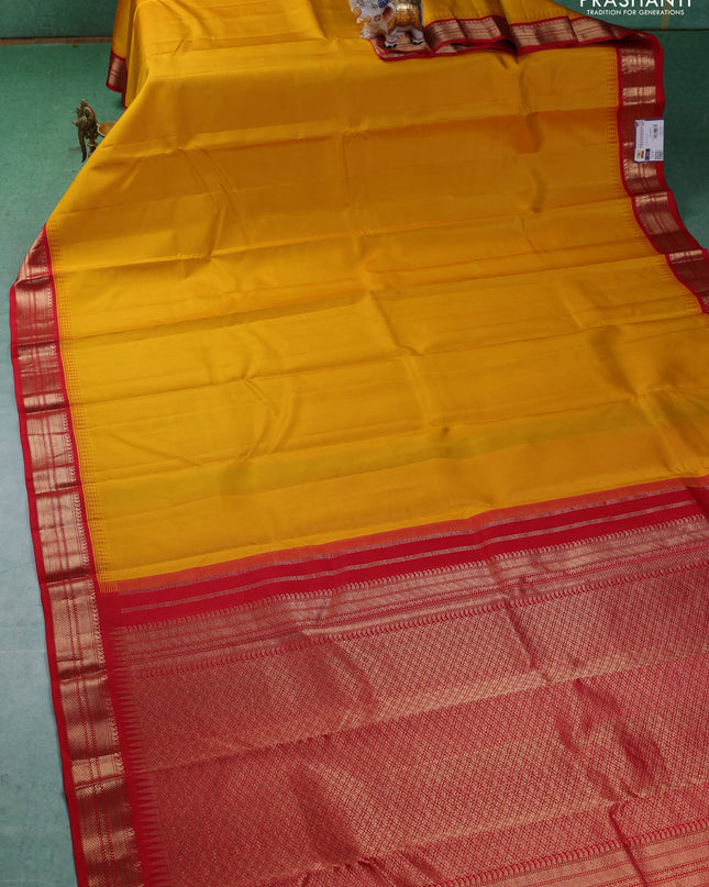 Pure kanchipuram silk saree mustard yellow and red with plain body and zari woven korvai border