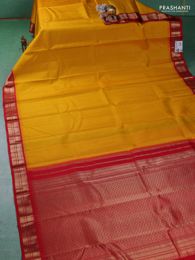 Pure kanchipuram silk saree mustard yellow and red with plain body and zari woven korvai border