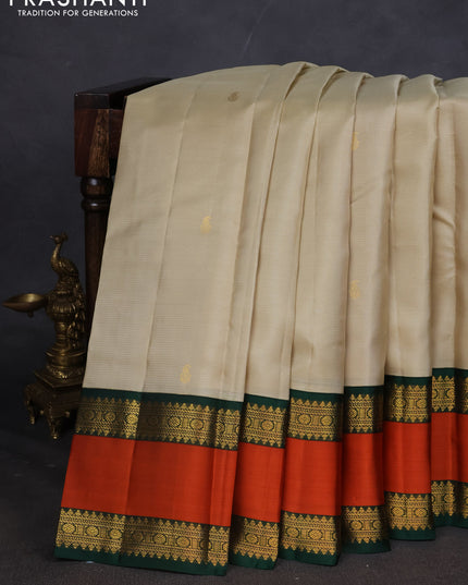 Pure kanchipuram silk saree beige and Bottle green with allover vairaosi pattern & buttas and rettapet zari woven border