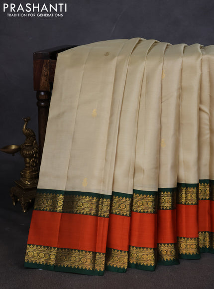 Pure kanchipuram silk saree beige and Bottle green with allover vairaosi pattern & buttas and rettapet zari woven border