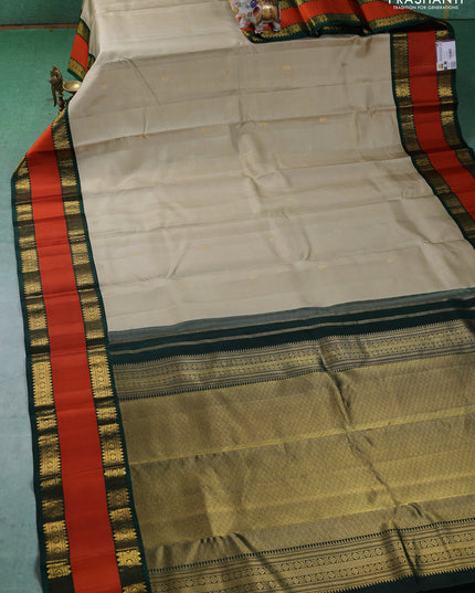 Pure kanchipuram silk saree beige and Bottle green with allover vairaosi pattern & buttas and rettapet zari woven border