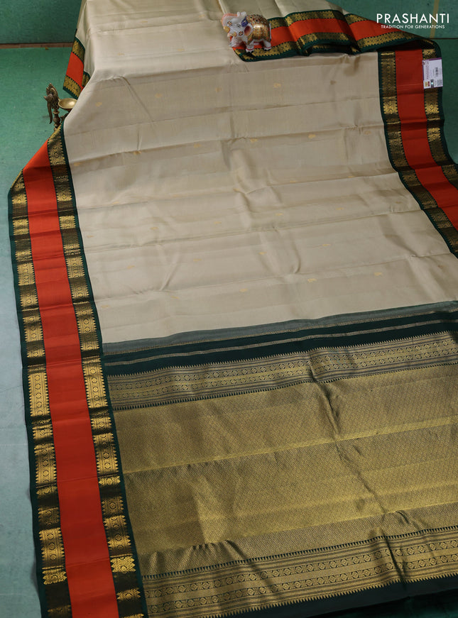 Pure kanchipuram silk saree beige and Bottle green with allover vairaosi pattern & buttas and rettapet zari woven border