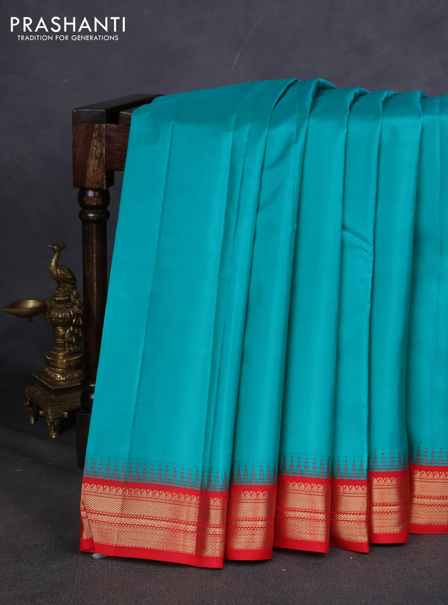 Pure kanchipuram silk saree blue and red with plain body and zari woven korvai border