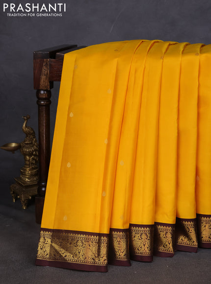 Pure kanchipuram silk saree yellow and brown with zari woven buttas and zari woven border