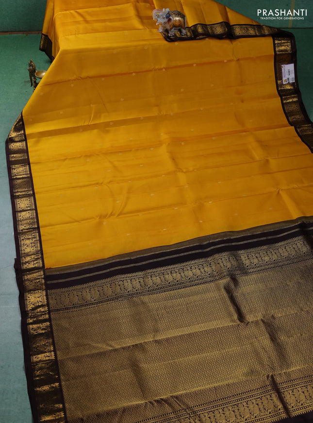 Pure kanchipuram silk saree yellow and brown with zari woven buttas and zari woven border