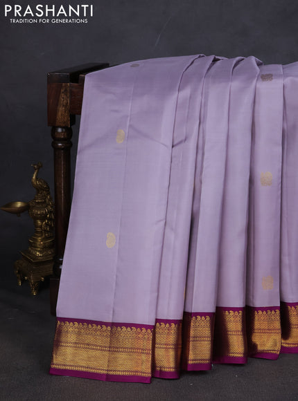 Pure kanchipuram silk saree grey and purple with annam & Paisley zari woven buttas and zari woven korvai border