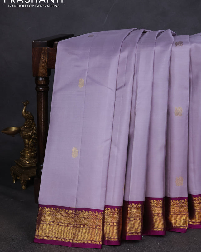 Pure kanchipuram silk saree grey and purple with annam & Paisley zari woven buttas and zari woven korvai border