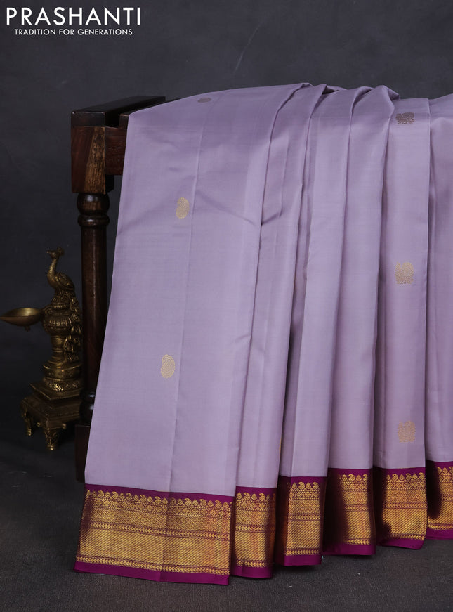 Pure kanchipuram silk saree grey and purple with annam & Paisley zari woven buttas and zari woven korvai border