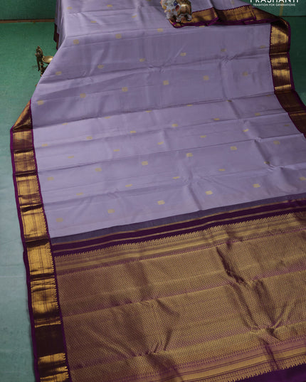 Pure kanchipuram silk saree grey and purple with annam & Paisley zari woven buttas and zari woven korvai border