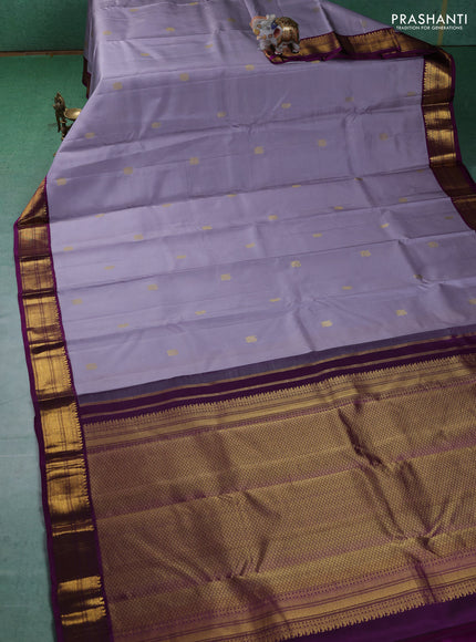 Pure kanchipuram silk saree grey and purple with annam & Paisley zari woven buttas and zari woven korvai border