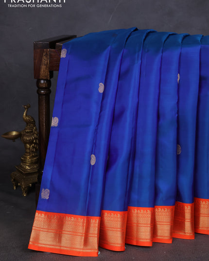 Pure kanchipuram silk saree blue and orange with annam & Paisley zari woven buttas and zari woven korvai border