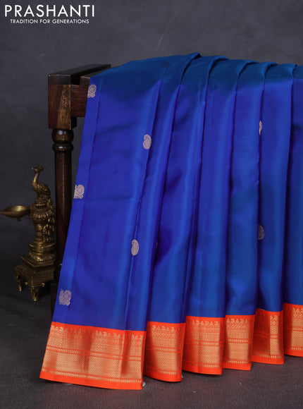 Pure kanchipuram silk saree blue and orange with annam & Paisley zari woven buttas and zari woven korvai border