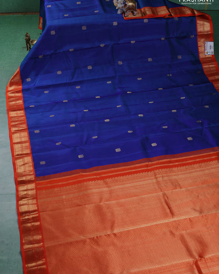 Pure kanchipuram silk saree blue and orange with annam & Paisley zari woven buttas and zari woven korvai border