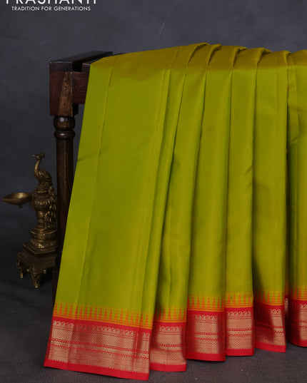 Pure kanchipuram silk saree lime green and red with plain body and temple design zari woven border