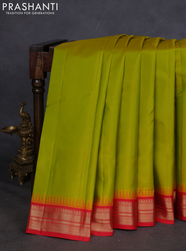 Pure kanchipuram silk saree lime green and red with plain body and temple design zari woven border
