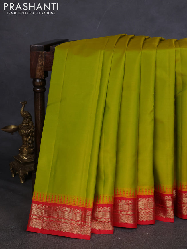Pure kanchipuram silk saree lime green and red with plain body and temple design zari woven border