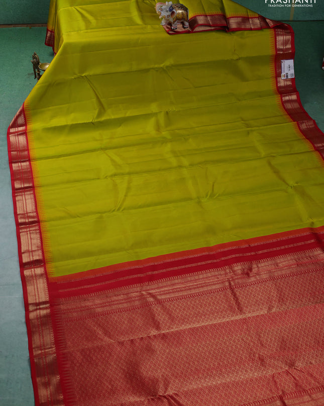 Pure kanchipuram silk saree lime green and red with plain body and temple design zari woven border