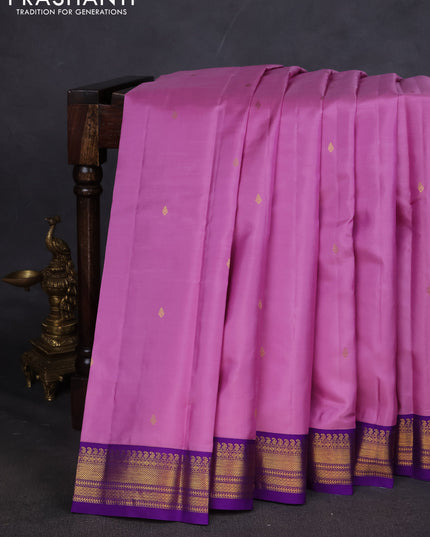 Pure kanchipuram silk saree lotus pink and violet with zari woven buttas and zari woven korvai border