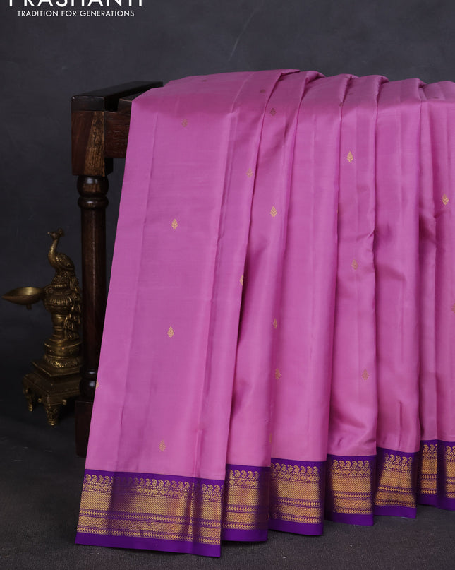 Pure kanchipuram silk saree lotus pink and violet with zari woven buttas and zari woven korvai border