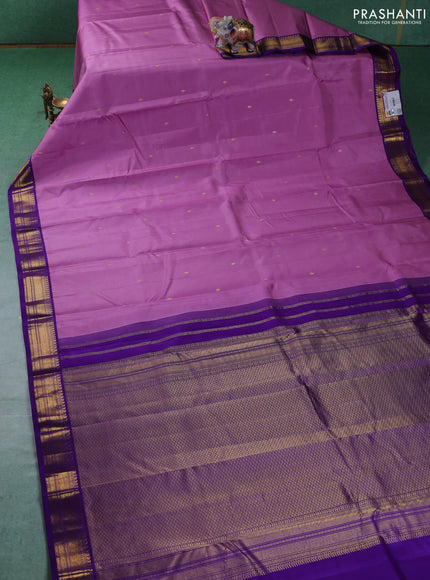 Pure kanchipuram silk saree lotus pink and violet with zari woven buttas and zari woven korvai border
