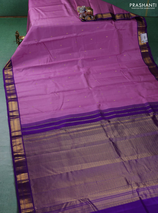 Pure kanchipuram silk saree lotus pink and violet with zari woven buttas and zari woven korvai border