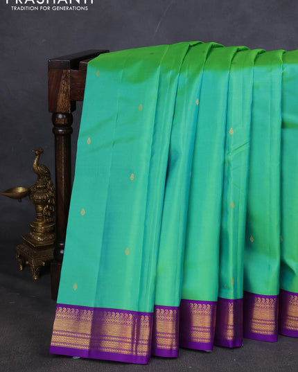 Pure kanchipuram silk saree teal green and violet with zari woven buttas and zari woven korvai border